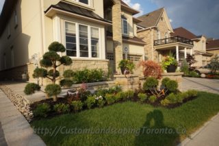 Patio Deck with large interlock and landscaping design
