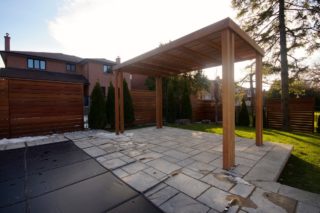 Landscaping project with deck and outdoor kitchen