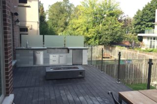 Landscaping project with Outdoor kitchen and water feature