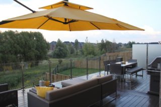 PVC DECK WITH GLASS RAILINGS AND FIREPIT